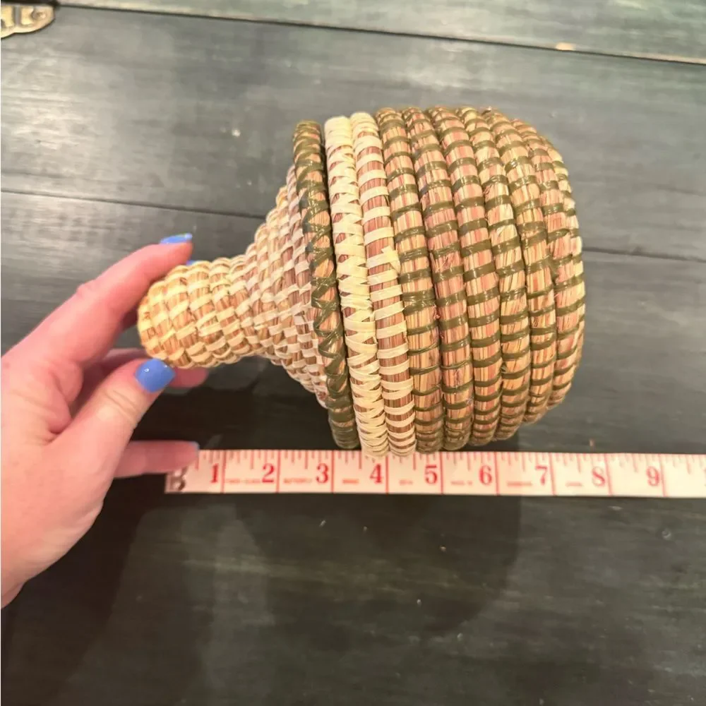 Handwoven sweetgrass coiled basket with a fitted lid
